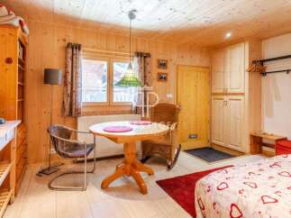 Cozy chalet-style interior with wooden walls and ceiling.