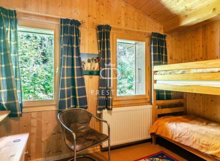Cozy cabin retreat with charming wooden interiors.