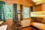 Cozy cabin retreat with charming wooden interiors.