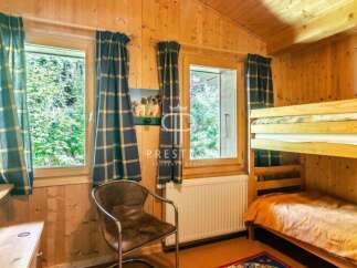Cozy cabin retreat with charming wooden interiors.