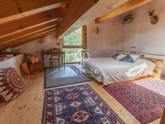 Discover a cozy bedroom retreat with rustic charm.