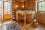 Discover the charm of this cozy wooden interior, perfect for a mountain retreat.