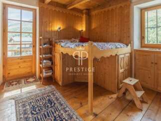 Discover the charm of this cozy wooden interior, perfect for a mountain retreat.