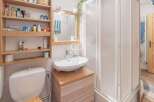 Discover a charming bathroom with a modern touch.