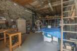 Discover the charm of this unique property, featuring a spacious workshop perfect for creative projects.