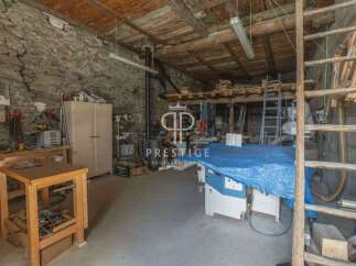 Discover the charm of this unique property, featuring a spacious workshop perfect for creative projects.