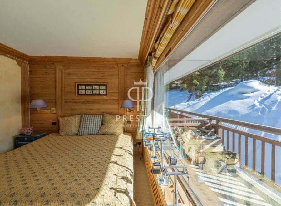 Experience the charm of this cozy bedroom with stunning mountain views.