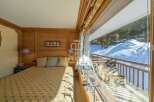 Experience the charm of this cozy bedroom with stunning mountain views.