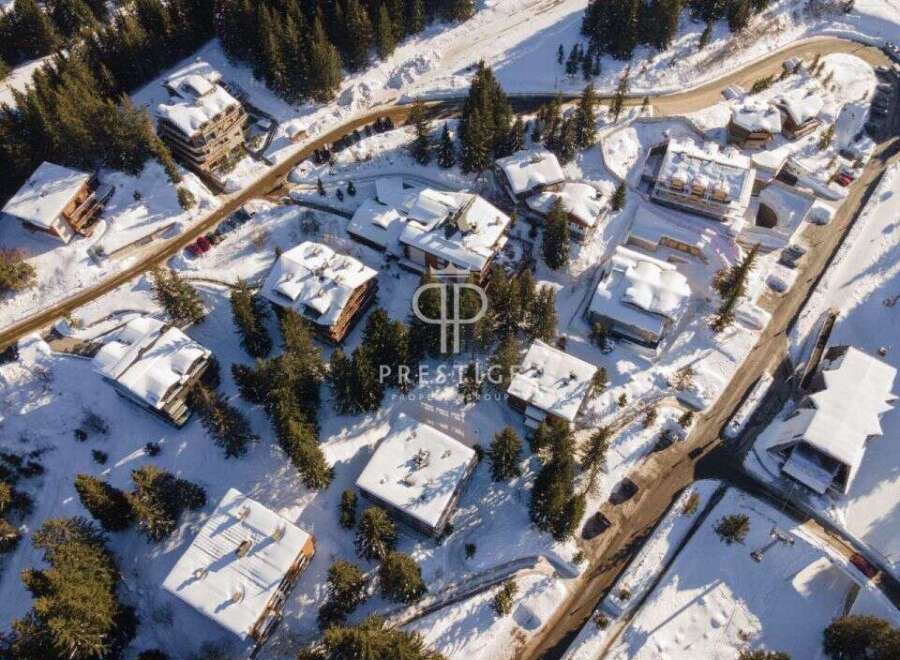Discover a winter wonderland with this stunning property nestled in a snowy landscape.