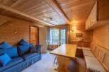 Step into a cozy retreat with this charming wooden interior.