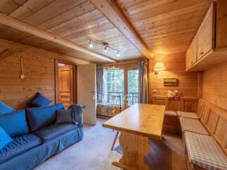 Step into a cozy retreat with this charming wooden interior.