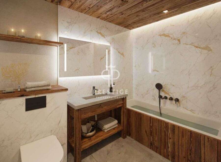 Experience luxury in this stunning bathroom, featuring exquisite marble walls and a warm wooden ceiling.