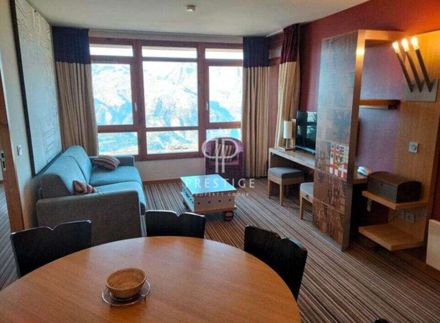 Experience luxury living in this stunning property, featuring a spacious living area with breathtaking mountain views.
