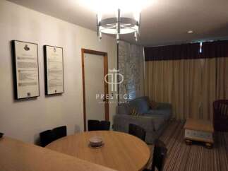 Discover a stylish property featuring a modern round dining table, perfect for gatherings.
