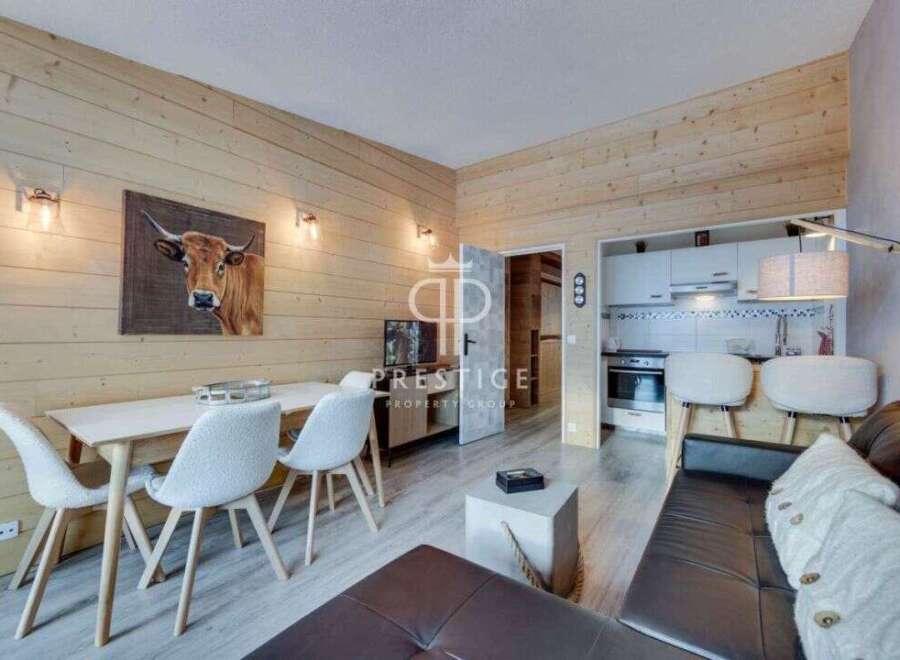 Discover a cozy retreat in this charming property, featuring a warm wooden interior and a stylish living space.