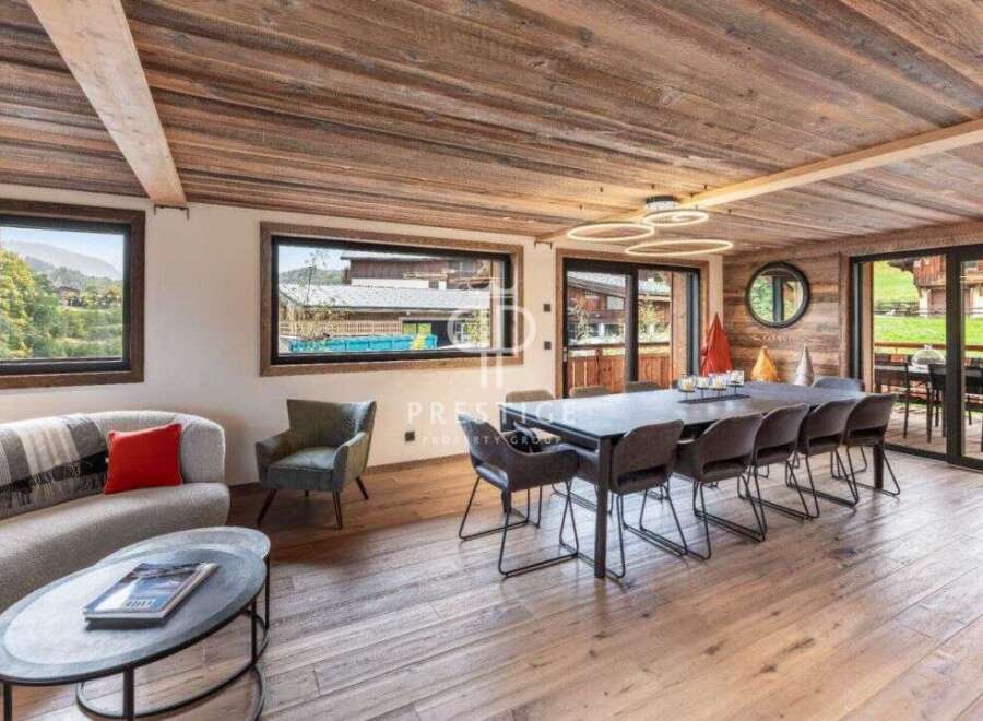 Experience luxury living in this stunning property, featuring a spacious dining area perfect for entertaining.