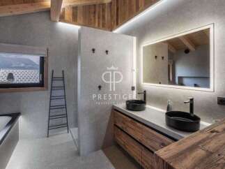Experience luxury in this stunning bathroom featuring a sleek design and modern amenities.