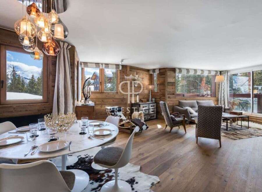 Experience luxury living in this stunning property, featuring a beautifully designed interior with wooden accents and a modern aesthetic.