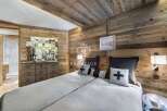 Experience rustic elegance in this stunning bedroom.