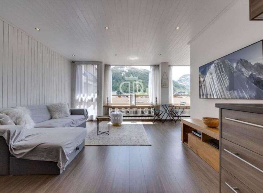 Experience breathtaking mountain views from this stunning living space.