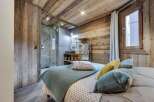Experience rustic luxury in this stunning bedroom.
