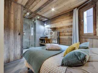 Experience rustic luxury in this stunning bedroom.