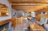 Experience the charm of this stunning property, featuring a cozy fireplace and rustic wooden beams.
