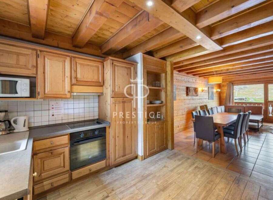 Discover the charm of this stunning property, featuring a beautifully designed kitchen with wooden cabinetry and modern appliances.