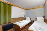 Cozy bedroom featuring two twin beds, perfect for a comfortable stay.