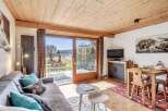 Discover a cozy retreat with this charming property, featuring a warm wooden ceiling and inviting living space.