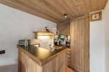 Discover the charm of this property, featuring a beautifully designed wooden bar area.