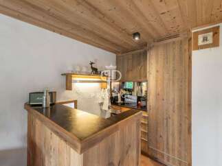 Discover the charm of this property, featuring a beautifully designed wooden bar area.