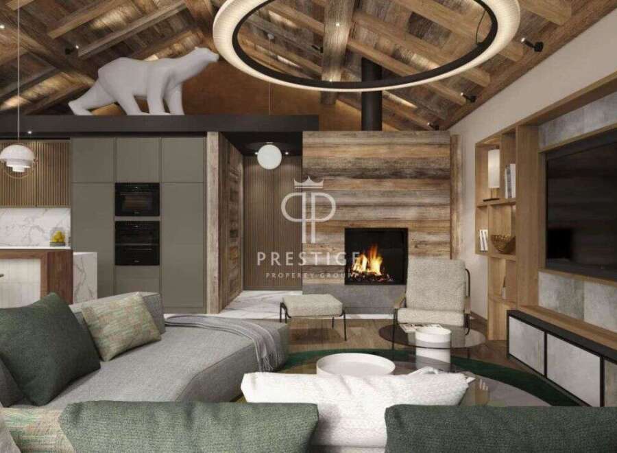 Experience luxury living in this stunning property, featuring a cozy fireplace and a modern kitchen.