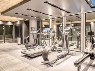 Experience the epitome of fitness in this state-of-the-art gym, fully equipped with modern exercise machines.