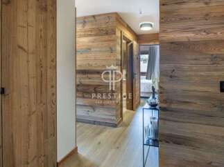 Step into luxury with this stunning property featuring exquisite wooden accents throughout.