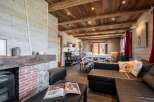 Experience rustic charm in this stunning property, featuring a cozy fireplace and exposed wooden beams.