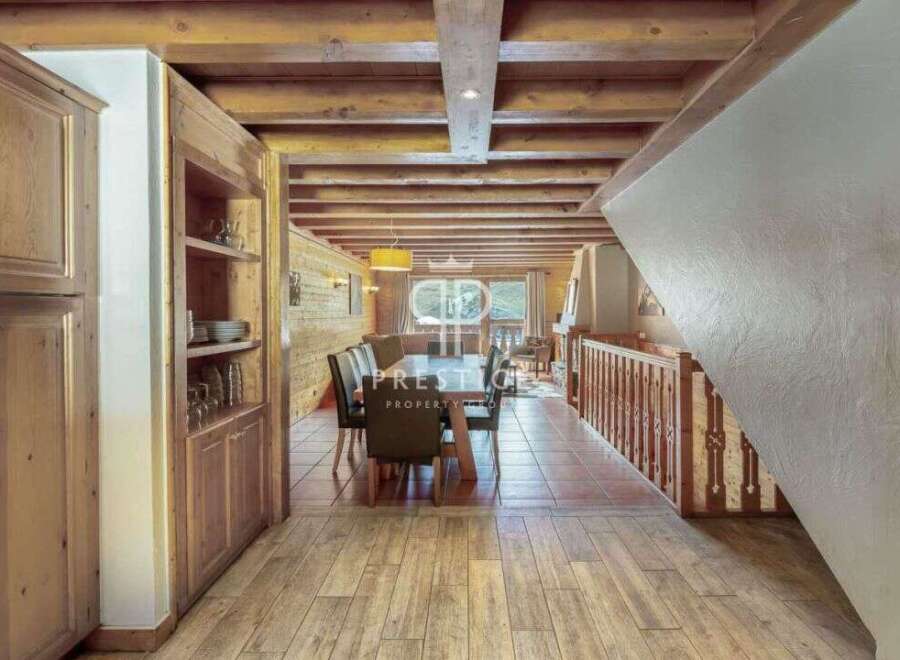 Discover the charm of this stunning property, featuring a warm and inviting interior with wooden accents throughout.