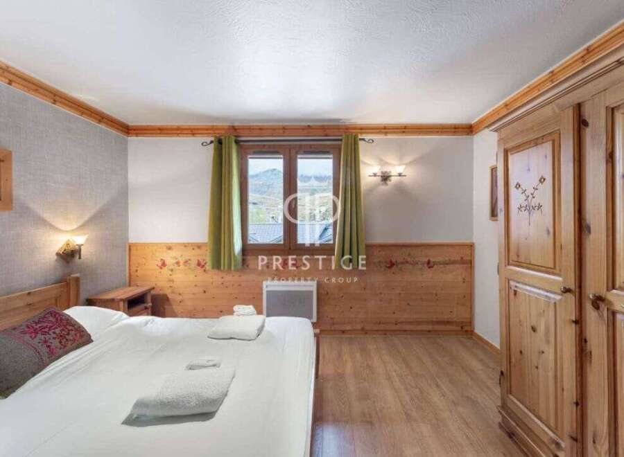 Discover a cozy bedroom with wooden accents, creating a warm and inviting atmosphere.