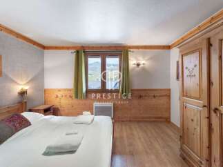 Discover a cozy bedroom with wooden accents, creating a warm and inviting atmosphere.