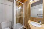 Discover a charming bathroom with a rustic wooden aesthetic.