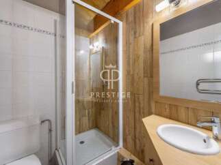 Discover a charming bathroom with a rustic wooden aesthetic.