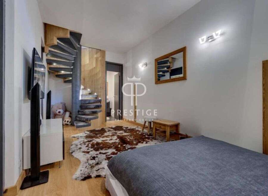 Discover luxury living in this stunning property featuring a unique spiral staircase.