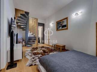 Discover luxury living in this stunning property featuring a unique spiral staircase.