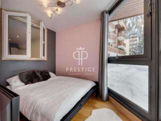Discover a cozy bedroom with a stunning view.