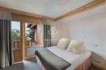 Discover the charm of this cozy bedroom with a stunning view.
