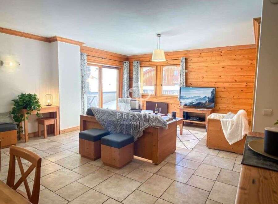 Discover the charm of this cozy living space, featuring warm wooden accents and a welcoming atmosphere.