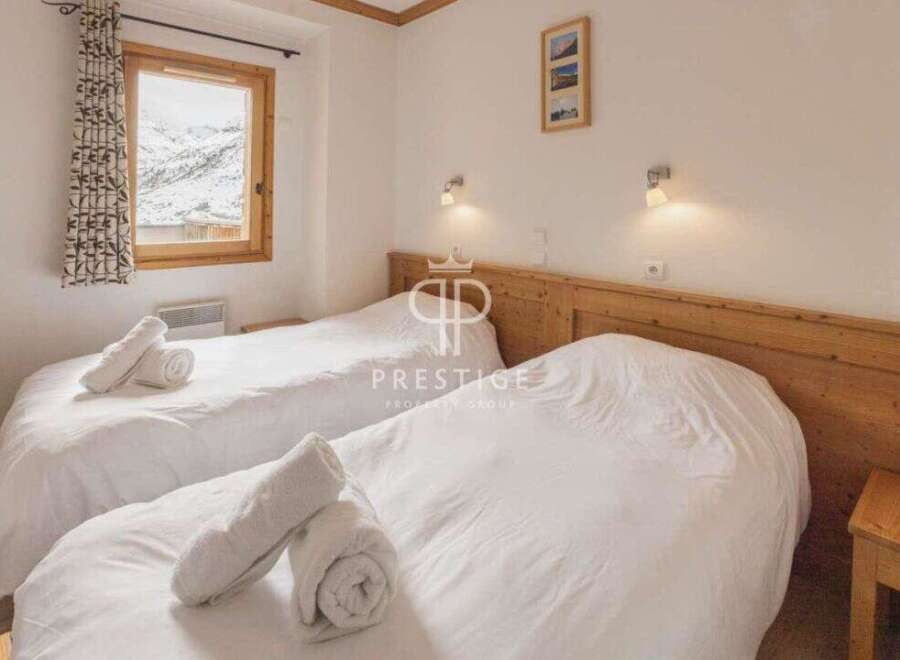 Cozy bedroom with two beds, perfect for a comfortable stay.