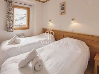 Cozy bedroom with two beds, perfect for a comfortable stay.