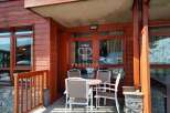 Discover a charming property with a cozy outdoor seating area, perfect for enjoying the mountain views.