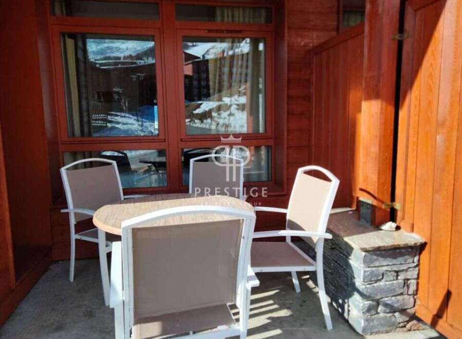 Enjoy the stunning mountain views from this charming outdoor seating area.